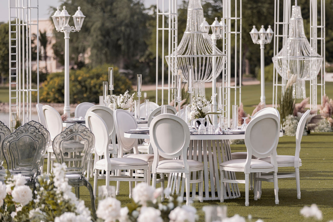 Outdoor wedding venue Dubai beach setup with flowers and lighting by Olga Events