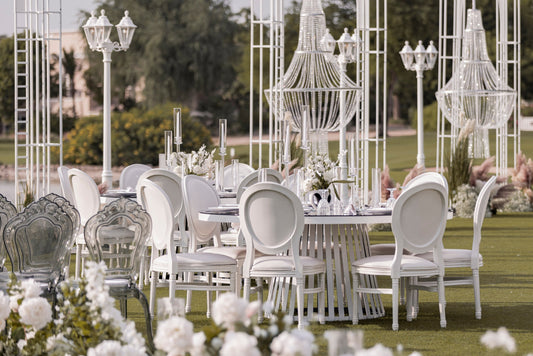 Outdoor wedding venue Dubai beach setup with flowers and lighting by Olga Events